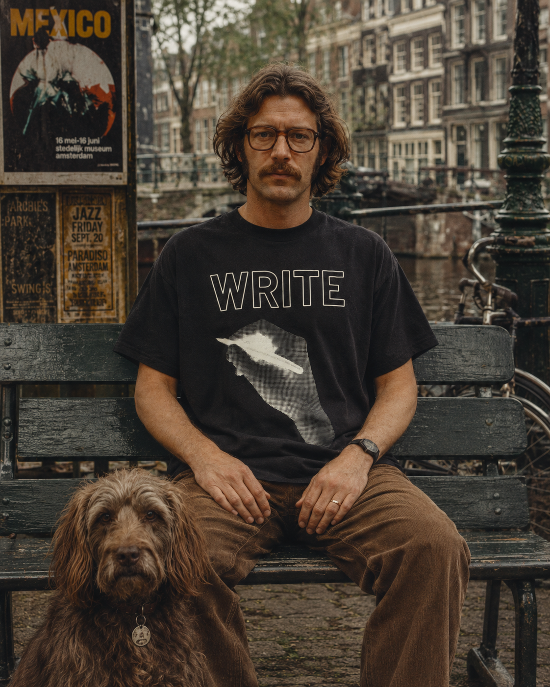 Write pen tee — man with dog on an Amsterdam canal bench.