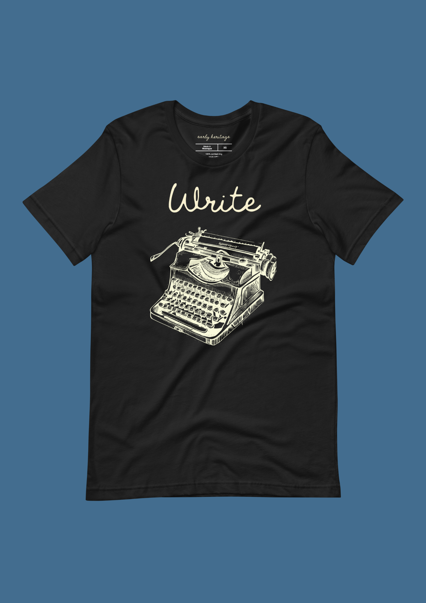 Write Typewriter Tee — cream 'Write' script over halftone typewriter on black.